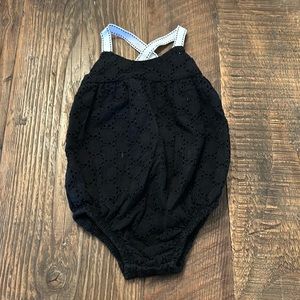 Black Eyelit baby girl onesie by Amy Coe